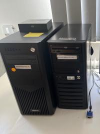 Two used Sun Blade 1500 Workstations in black Chieftec tower cases, labeled Reference Computer 1 and 2, shown with included keyboard and mouse.