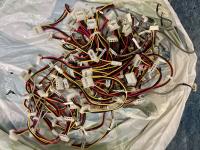 Large bulk collection of internal IDE Power Y-splitter cables with 4-pin Molex connectors, featuring identification labels for 'SYSTEM', 'HDD 0', and 'IDE Power Cable'.