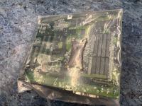 Backside of new SUN BJ41-00038A motherboard for Blade 1500, sealed in anti-static plastic, showing the TACO Socket 939 CPU plate and DDR memory slots. 