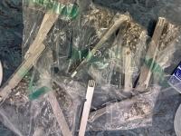 Bulk collection of PC and Oracle Sun Blade workstation housing screws and silver expansion slot panels individually bagged in clear plastic.